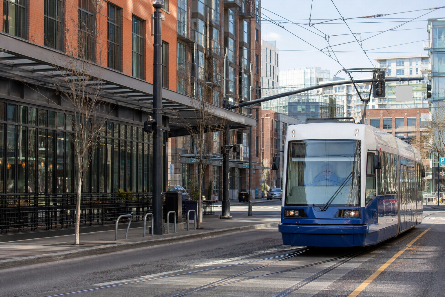 Modern American streetcar on urban tracks with overhead catenary wires